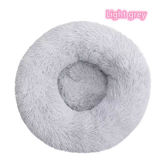 "Calming donut dog bed in Light grey color- in front view 