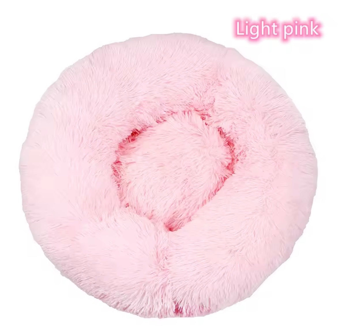 "Calming donut dog bed in light pink – front view"